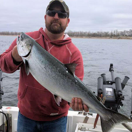 man from Sodus Point proudly shows his king salmon